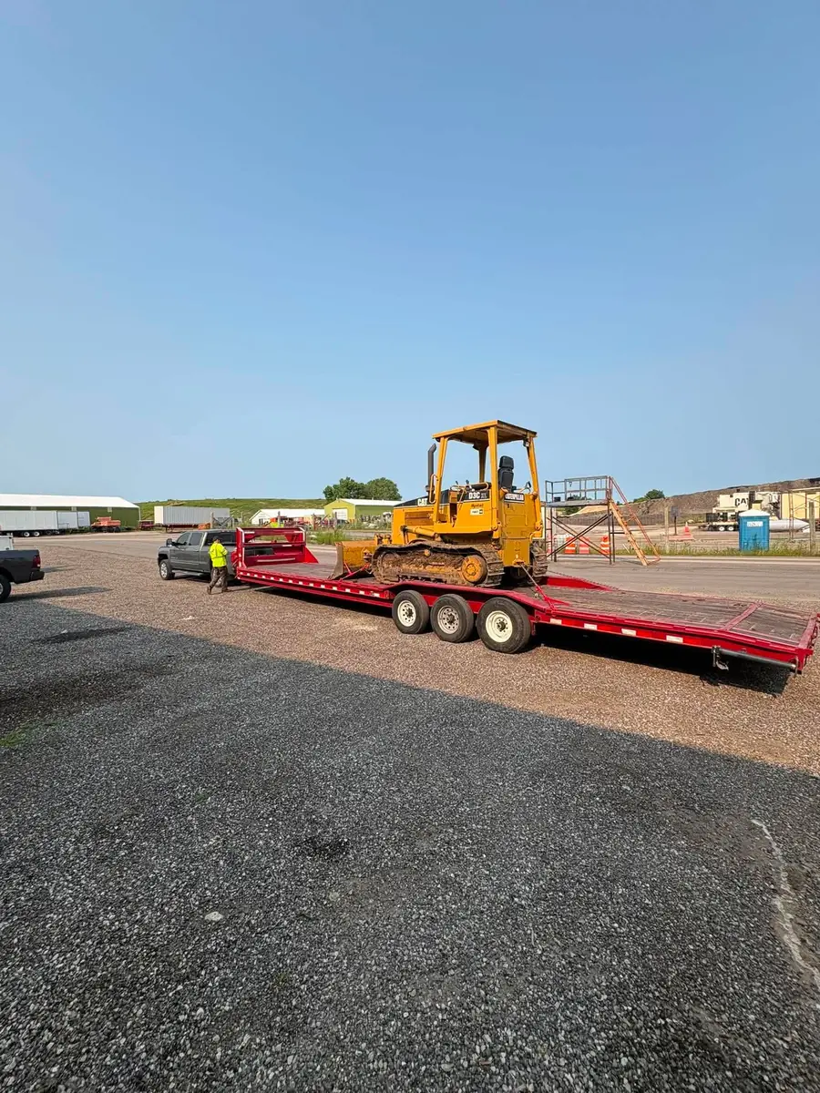 Arnold's Diesel Repair hauling heavy equipment